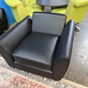 Club chair in black leather.